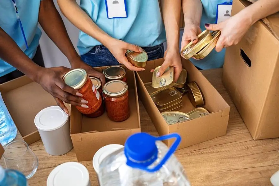 Volunteers sorting food donations at a local food bank