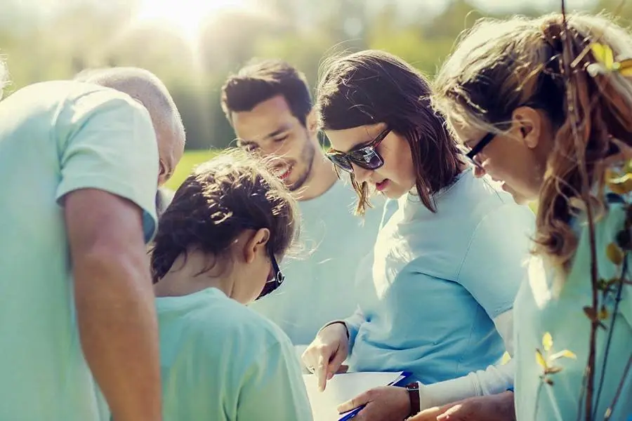 A volunteer group planning a neighborhood tree-planting project