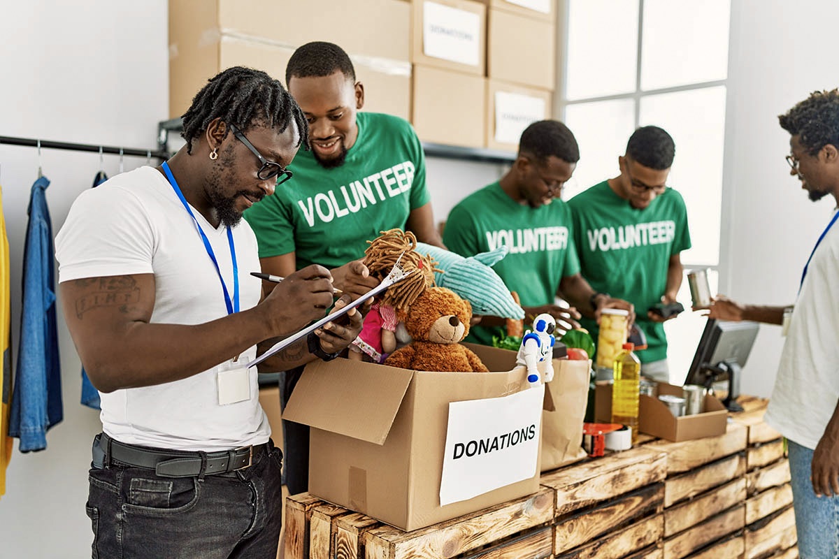Volunteers packing donation boxes for a local charity partner