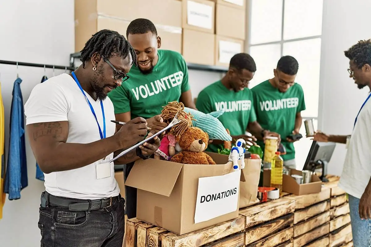 Volunteers packing donation boxes for a local charity partner